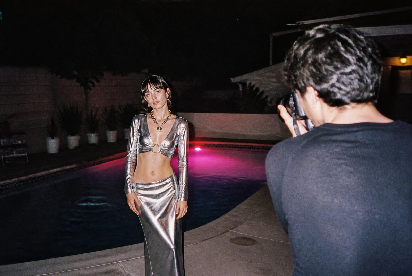 Photographers and models creating beside the pool at night