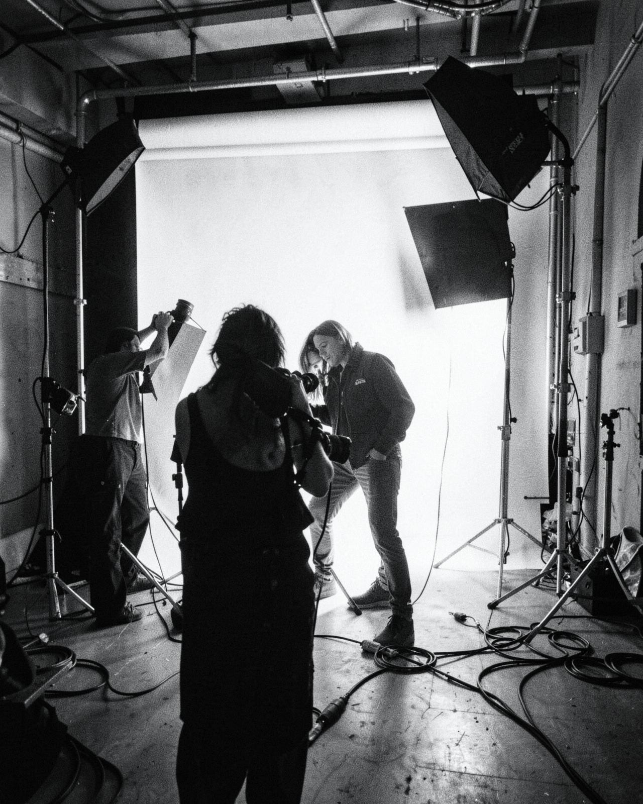 Behind the scenes of a photo shoot in an industrial studio